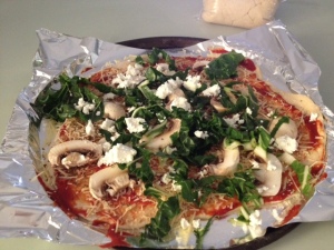In this pizza we have added spinach, mushrooms, garlic, oregano and feta cheese.